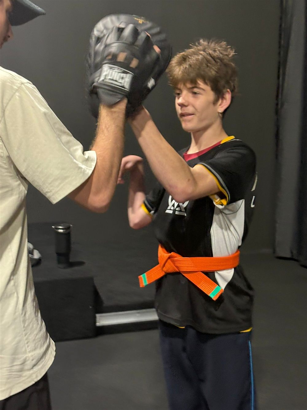 Pad and mitt work with an instructor